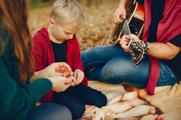 Free photo family with little son in a autumn park