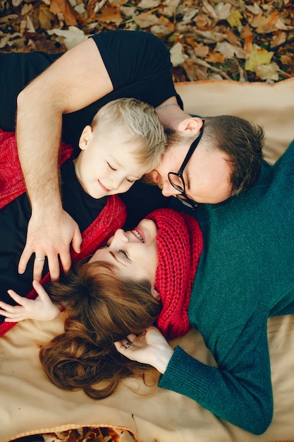 Family with little son in a autumn park