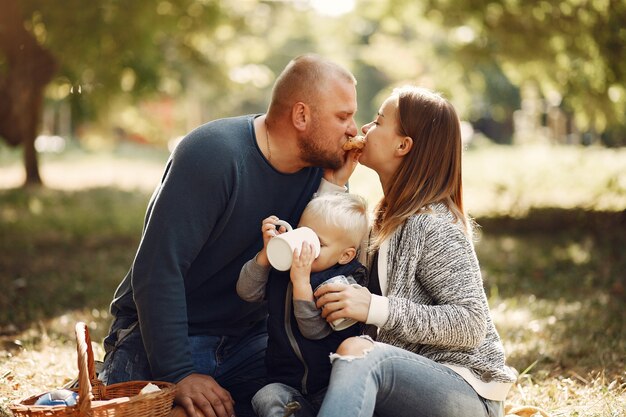 Family with little son in a autumn park