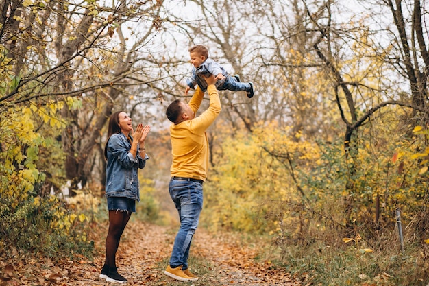 Family with a little son in autumn park