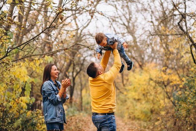 Family with a little son in autumn park