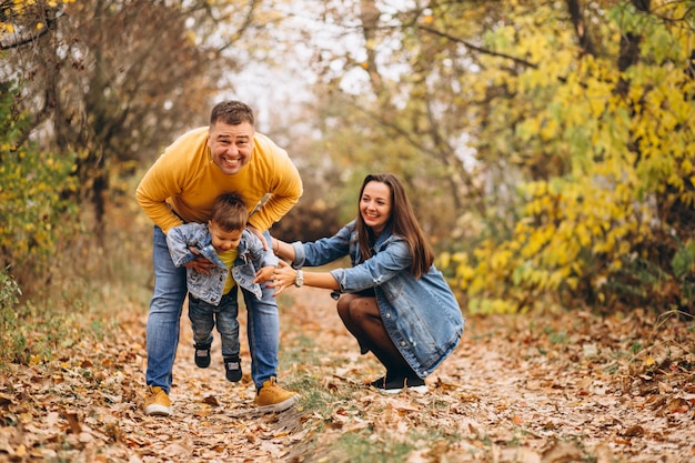 Family with a little son in autumn park