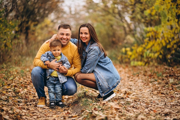 Family with a little son in autumn park