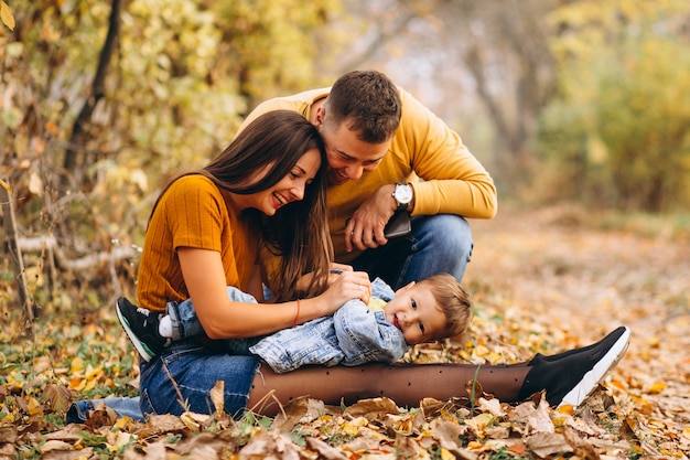 Free photo family with a little son in autumn park