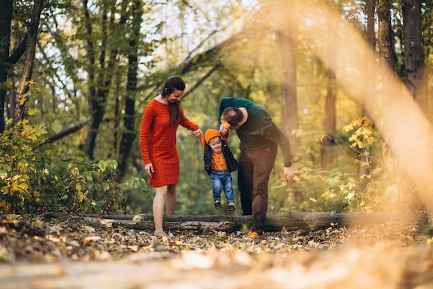 Family with a little son in autumn park