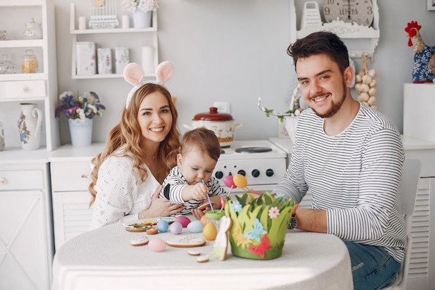 Family with little son painting