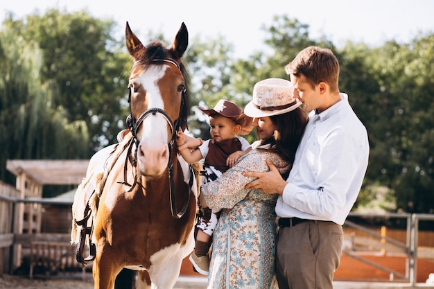 Family with little son at ranch