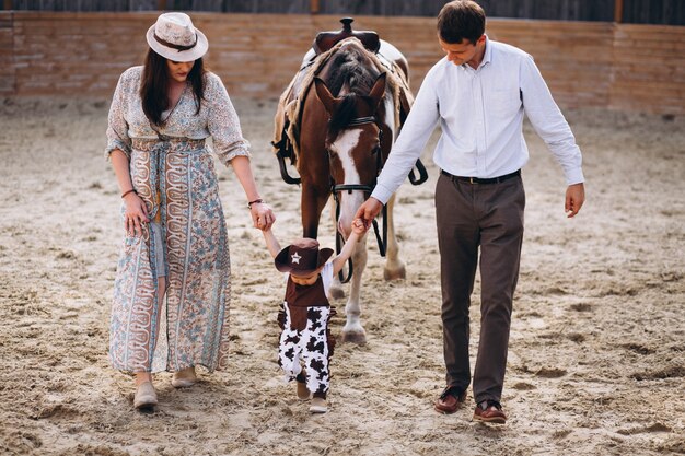 Family with little son at ranch