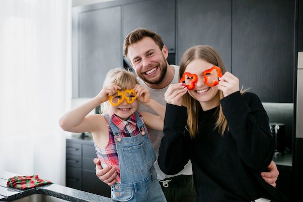 Family with pepper glasses looking at camera