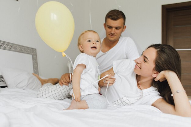 A family with a small child enjoys a light morning