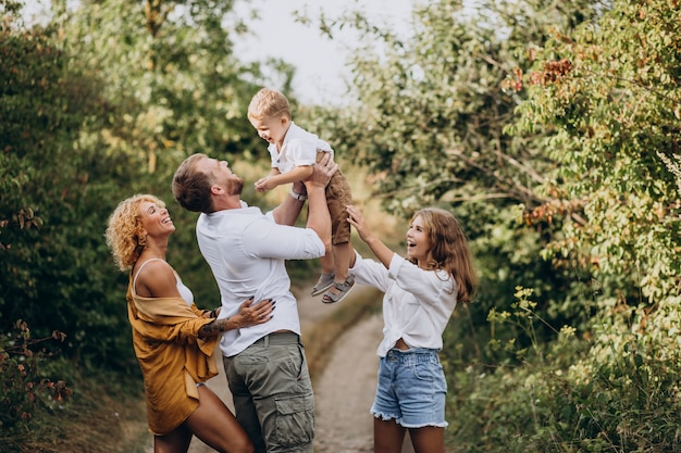 Free photo family with son and daughter together in park