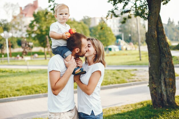 Family with son playing in a summer park