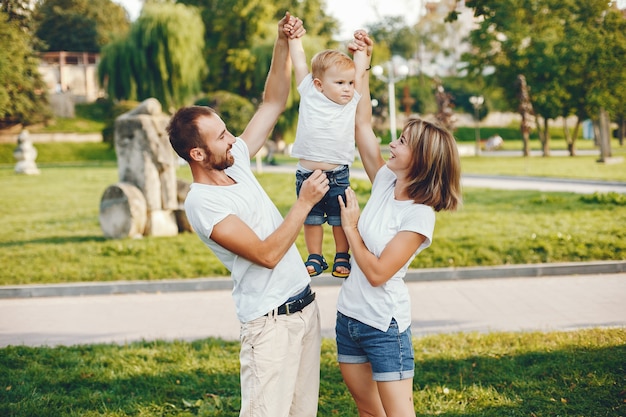 Family with son playing in a summer park