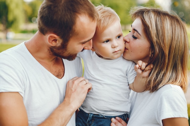 Family with son playing in a summer park