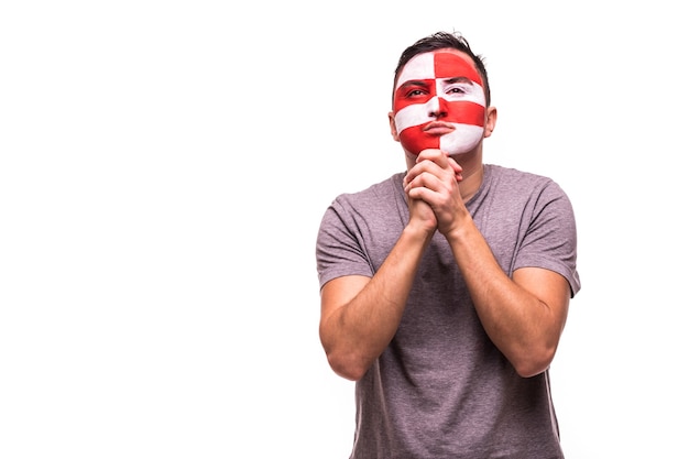 Fan support of Croatia national team pray with painted face isolated on white background