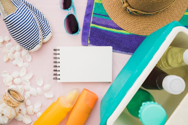 Fantastic composition with blank notebook and summer elements