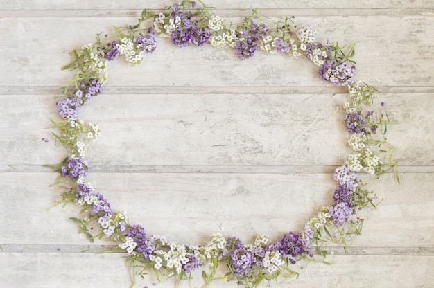 Free Photo fantastic floral frame on wooden surface