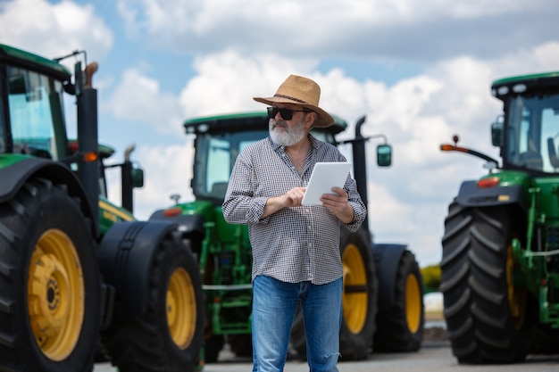 Free Photo a farmer with tractors