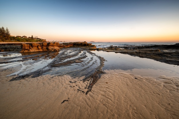 Fascinating shot of a sandy beach at sunset