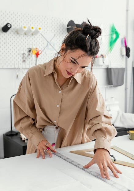 Fashion designer working in her workshop alone