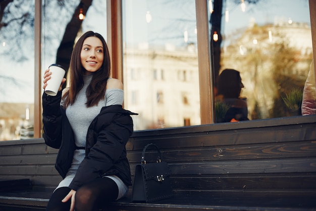 Free Photo fashion girl sitting in a summer city