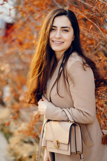 Fashion girl walking in a sspring park