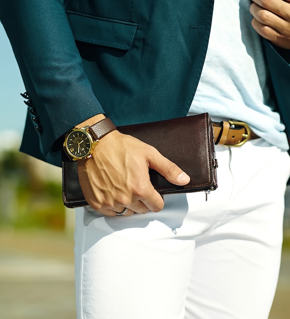 Free photo fashion portrait of young businessman handsome model man in casual cloth suit with accessories on hands