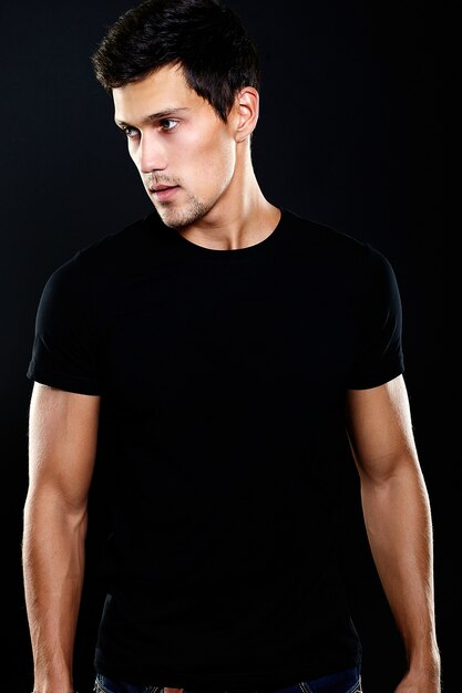 Fashion portrait of young caucasian man. Handsome model in casual clothes posing in studio. Attractive male