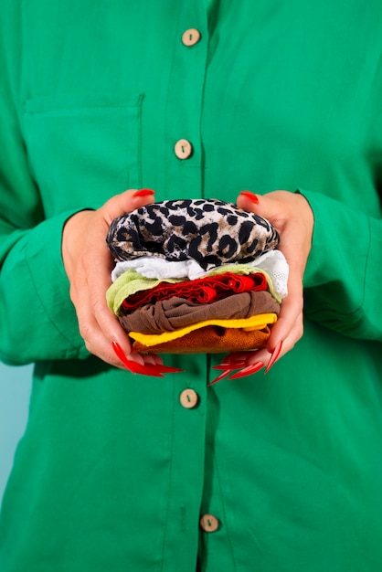 Free photo fast fashion concept with materials and textiles disguised as burger