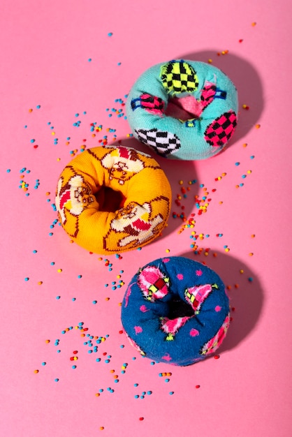 Free photo fast fashion concept with materials and textiles disguised as donuts