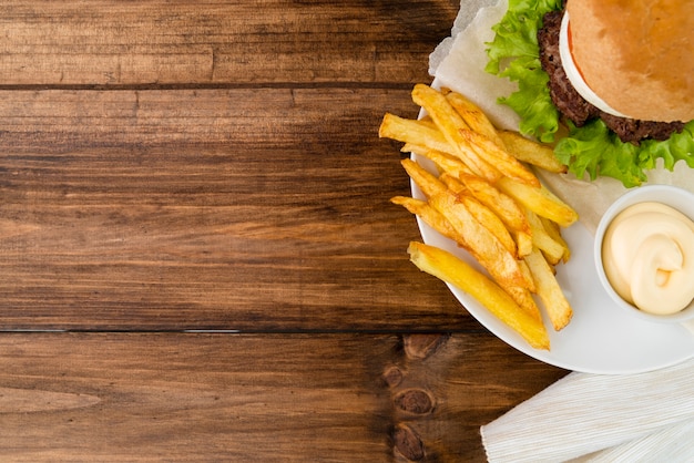 Fast food meal on wooden table with copy space