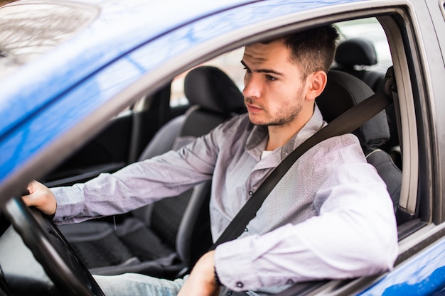 Fasten the car seat belt. Young man Safety belt safety first while driving