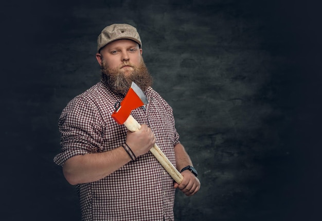 Free Photo fat bald, bearded man holds an axe and fire woods.