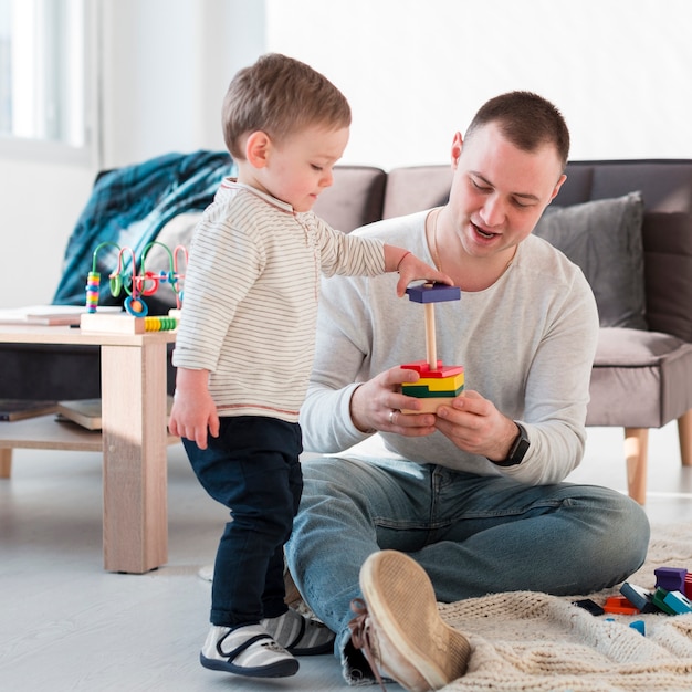 Father and child playing at home