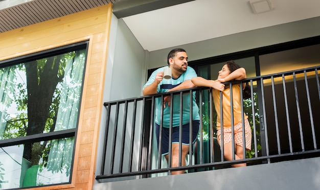 Father and daughter at the balcony