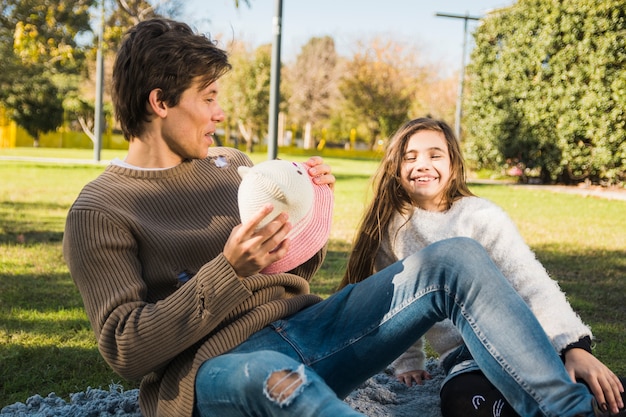 Father and daughter having fun together in park