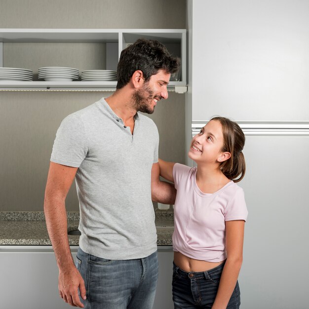 Father and daughter in kitchen on fathers day