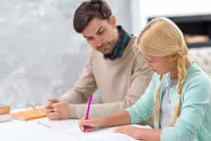 Free photo father and daughter learning new information