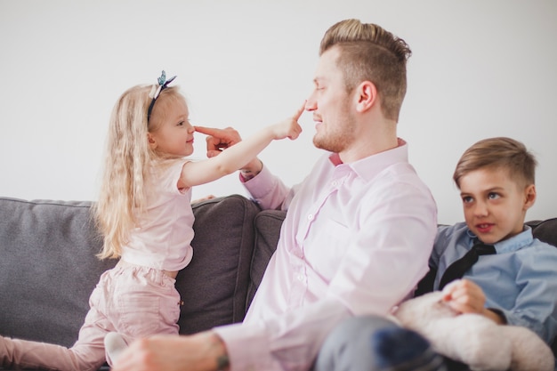 Father and daughter touching their noses