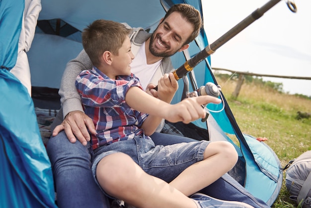 Father and his son fishing on the camping