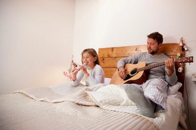 Father and little girl with musical instruments