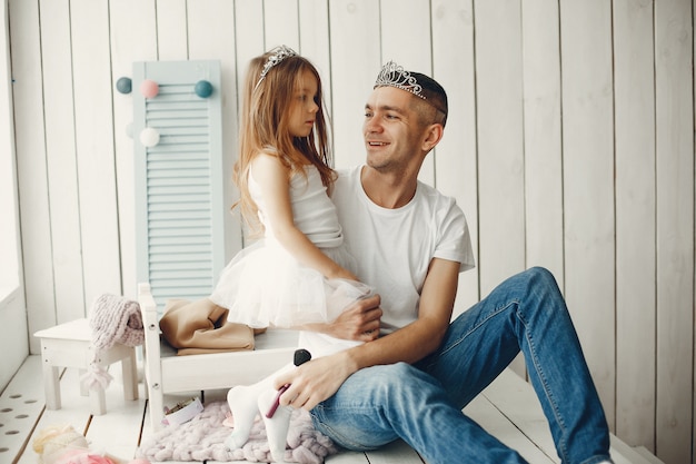 Father playing with a little daughter