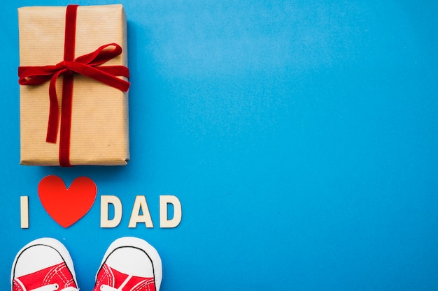 Free photo father's day composition with present, shoes and blank space