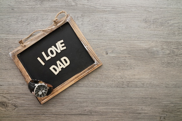 Free photo father's day composition with slate and watch