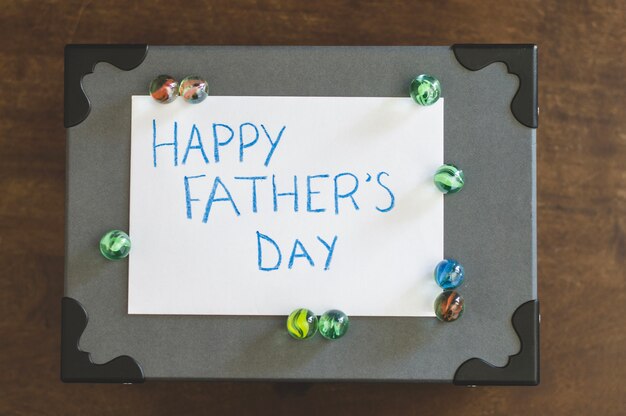 Father's day writing on box with marbles