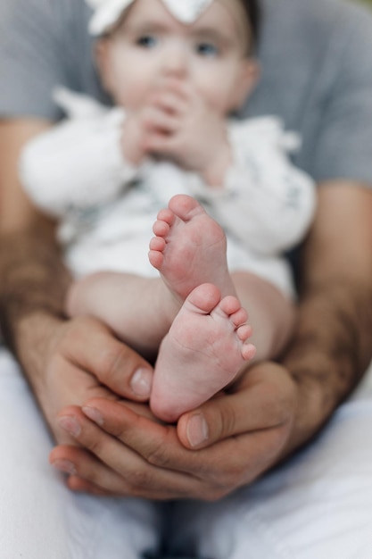 Free photo father and small child baby