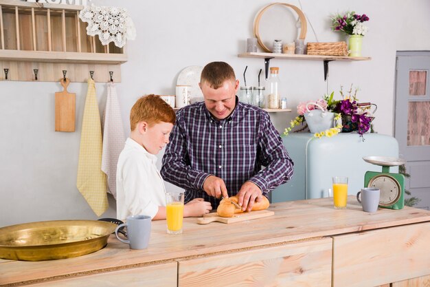 Father and son cooking together