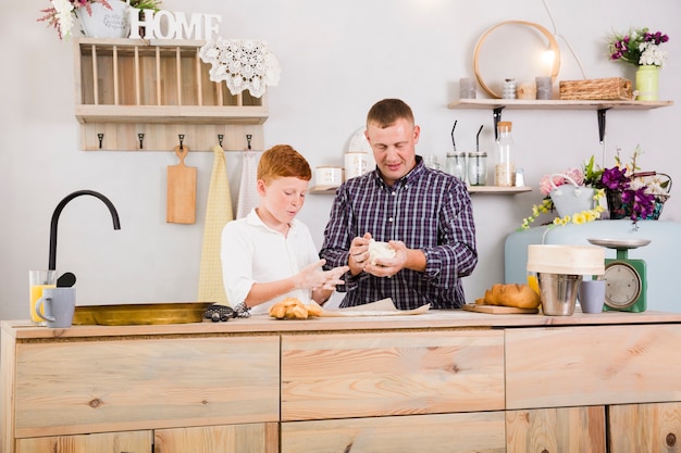 Father and son cooking together