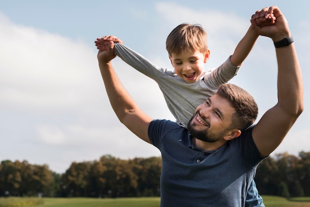 Father and son having a good time in the park