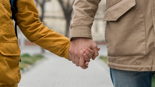 Father and son holding hands